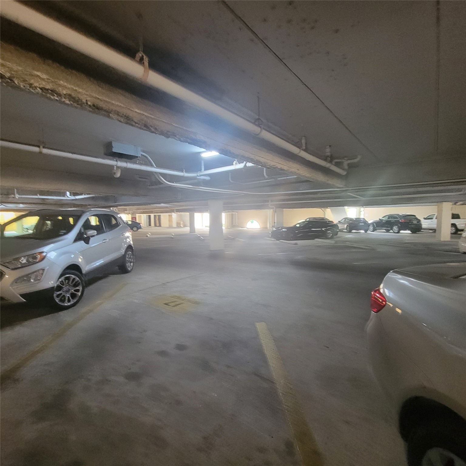 2333 Bering Drive, Unit 226 Houston, TX 77057 - Photo 33 of 33 a view of parking garage with cars parked