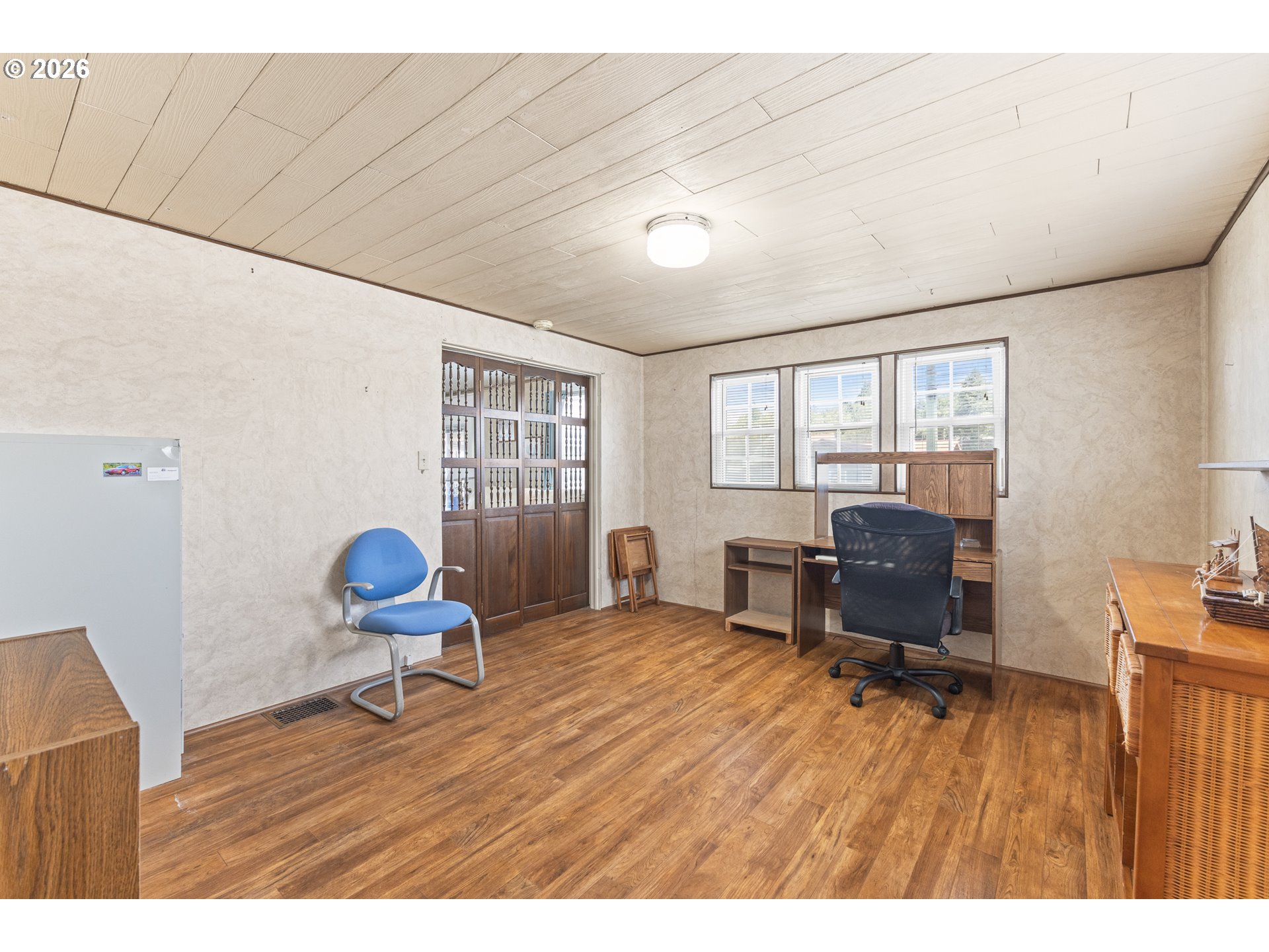 208 7th Street Myrtle Point, OR 97458 - Photo 34 of 48 a workspace with furniture hardwood and a window