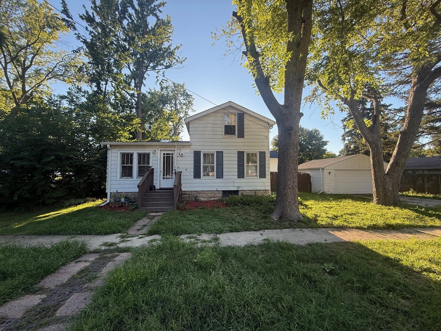 10-12 South Somonauk Road Cortland, IL 60112 - Photo 14 of 29 a front view of a house with a yard