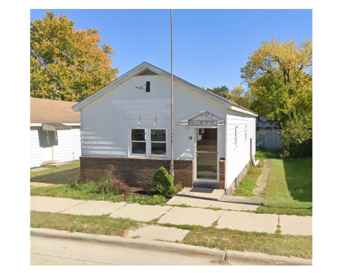 10-12 South Somonauk Road Cortland, IL 60112 - Photo 9 of 29 a front view of a house with garden