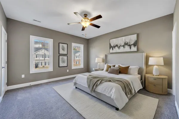 a bedroom with a large bed and a window