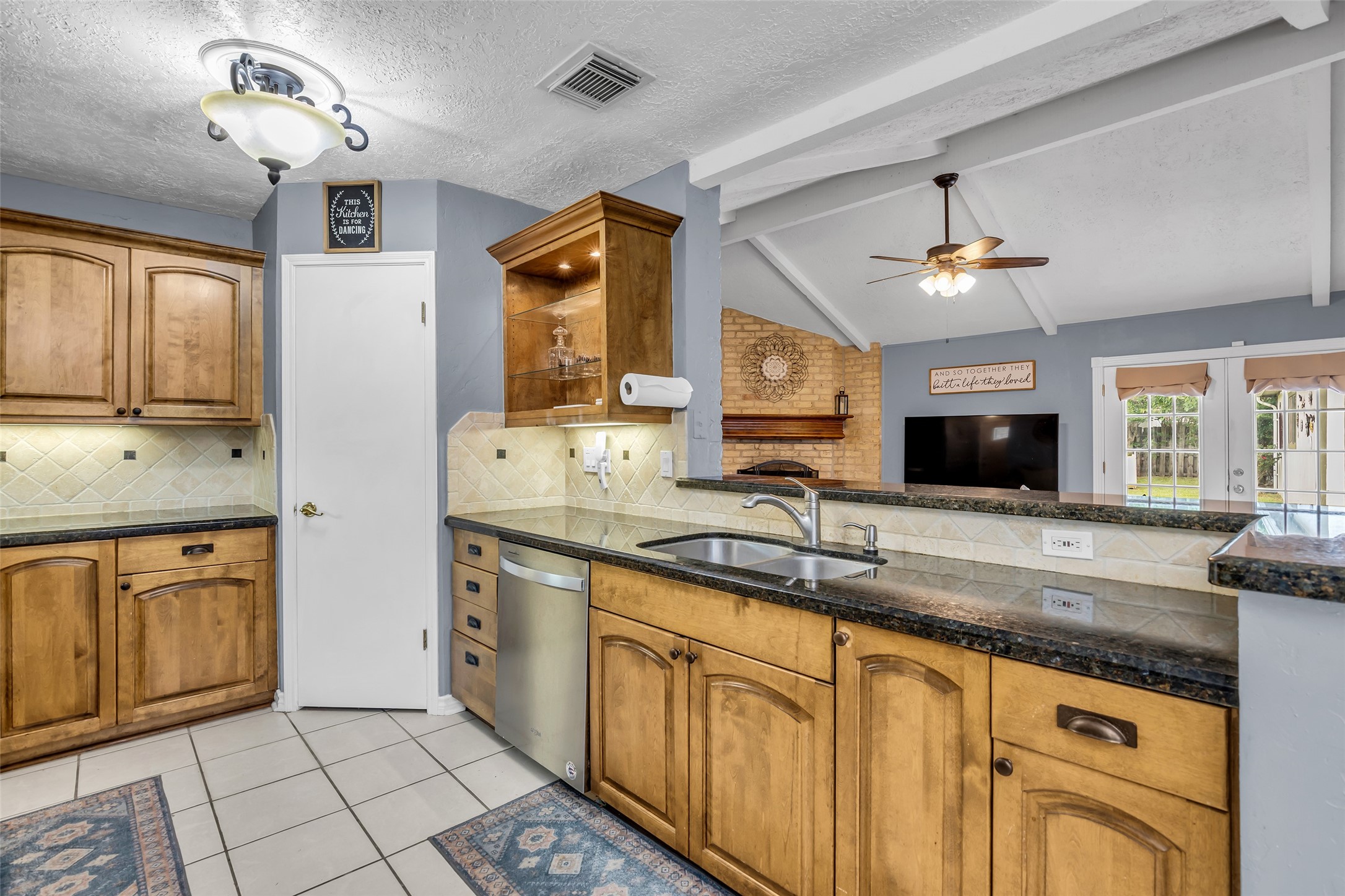 21807 Meadowhill Drive Spring, TX 77388 - Photo 14 of 25 a kitchen with stainless steel appliances granite countertop a sink and dishwasher a stove with wooden floor
