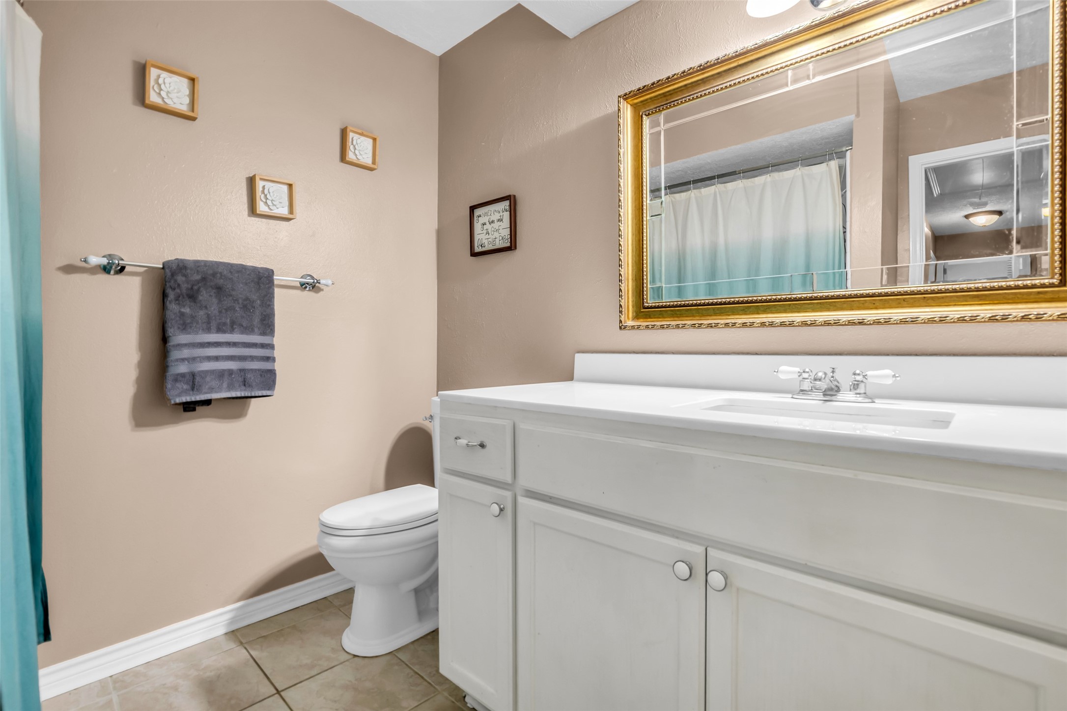 21807 Meadowhill Drive Spring, TX 77388 - Photo 18 of 25 a bathroom with a sink a toilet and a mirror