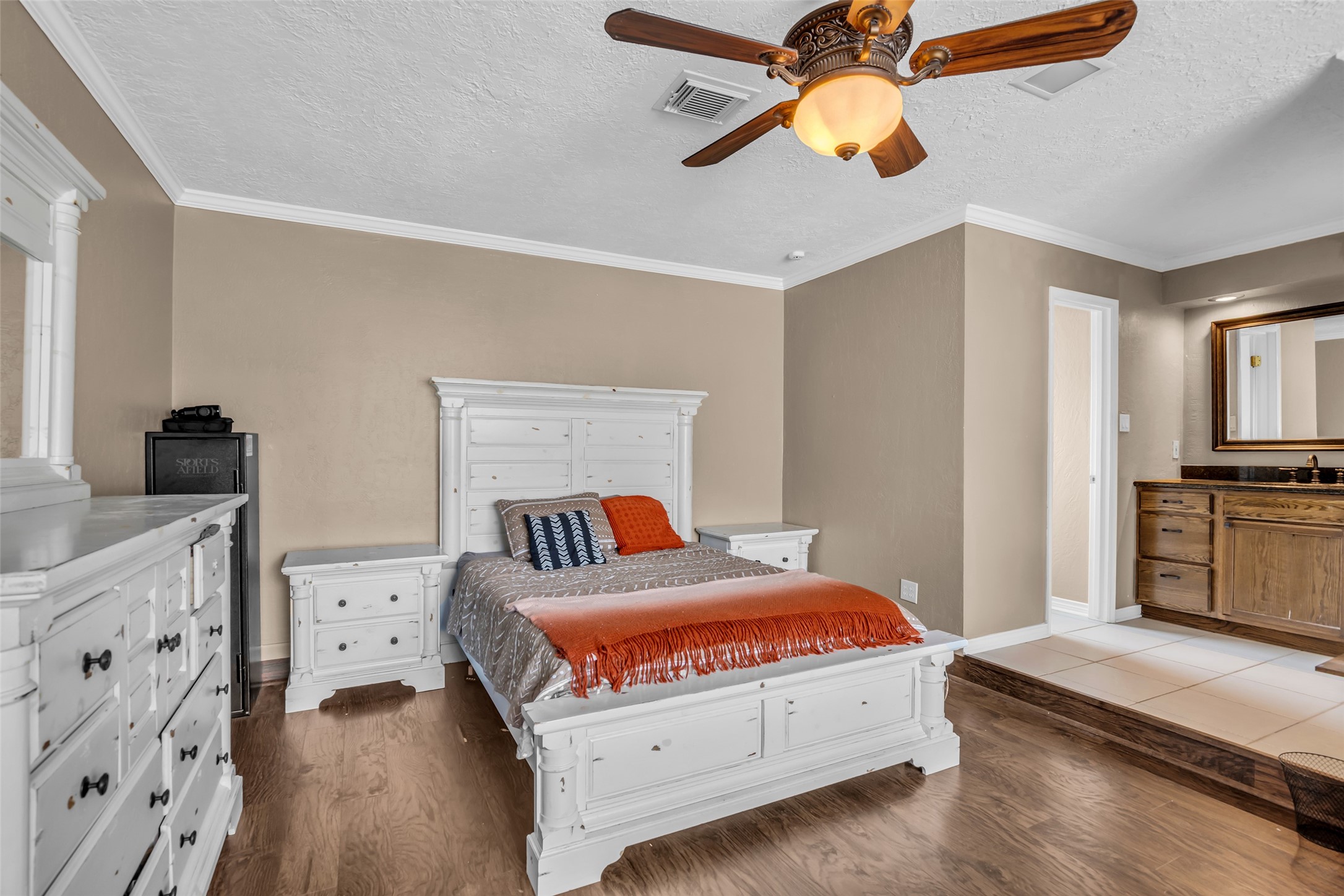 21807 Meadowhill Drive Spring, TX 77388 - Photo 20 of 25 a bedroom with a bed and a chandelier
