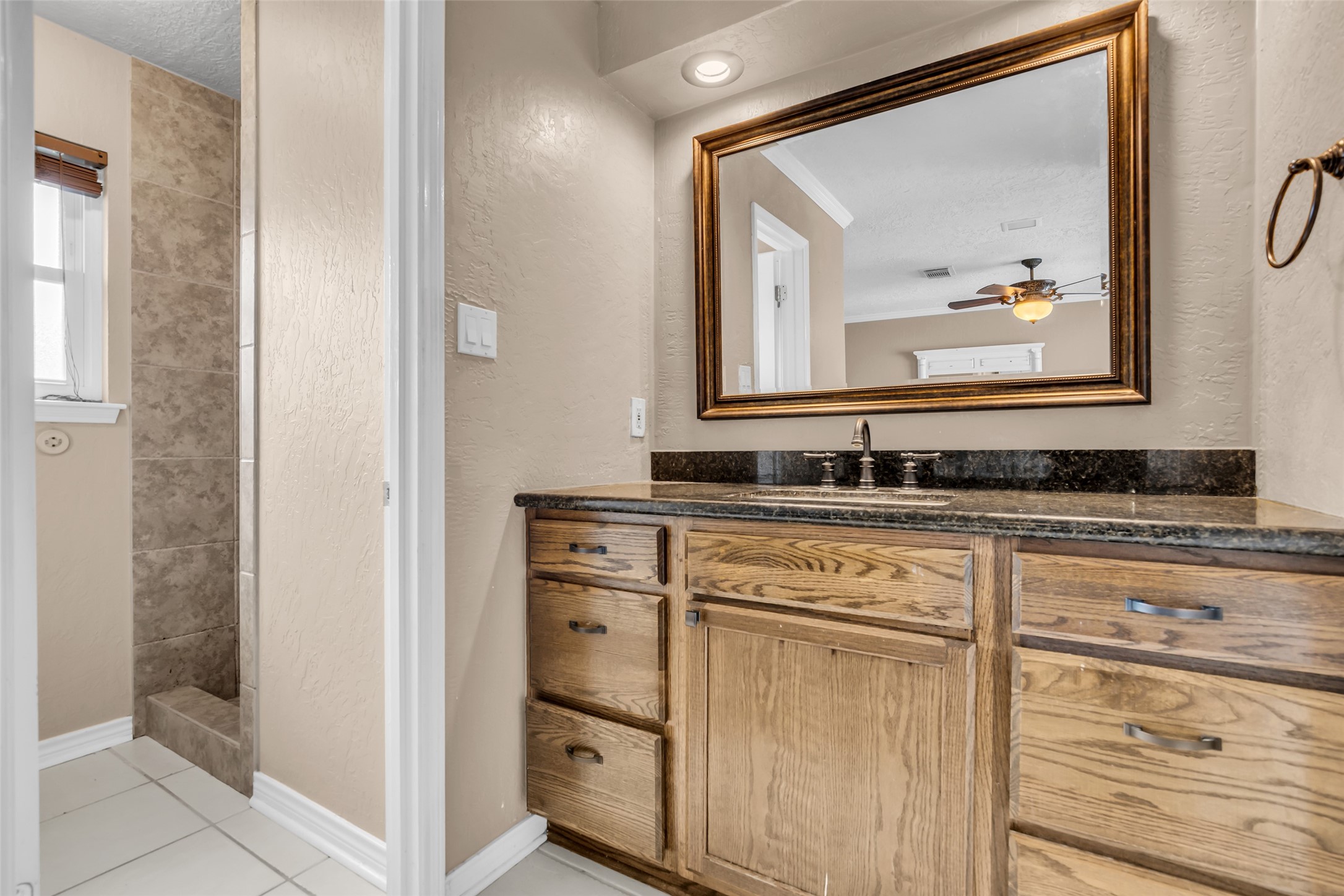 21807 Meadowhill Drive Spring, TX 77388 - Photo 21 of 25 a bathroom with a sink and a mirror
