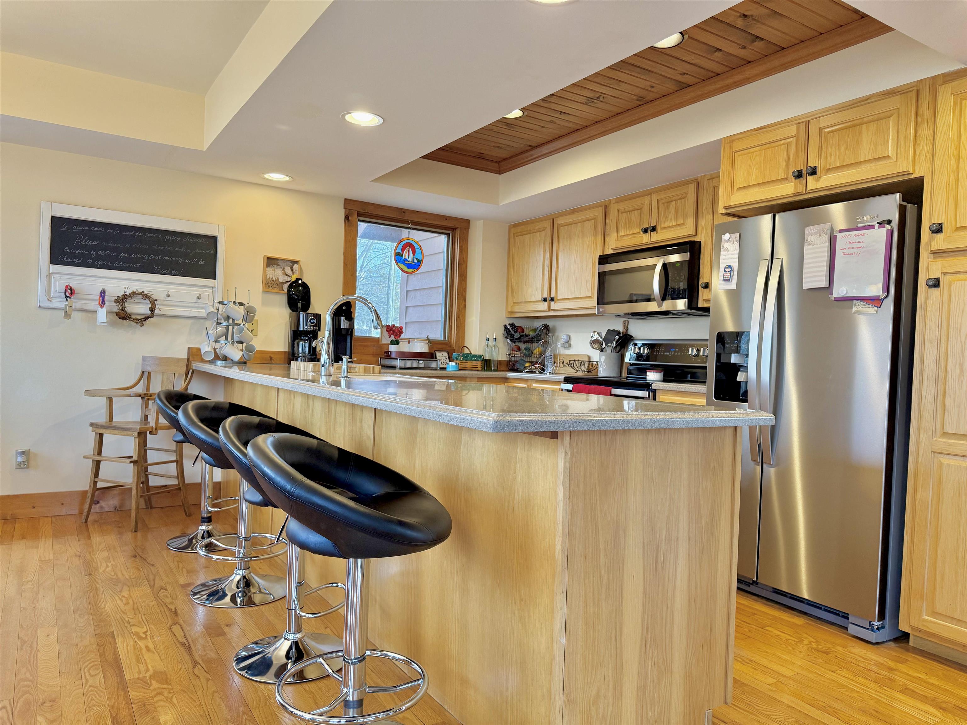 1 Tamarack Row Elizabeth, IL 61028 - Photo 11 of 38 a kitchen with stainless steel appliances granite countertop a refrigerator a stove a sink dishwasher with a dining table and chair
