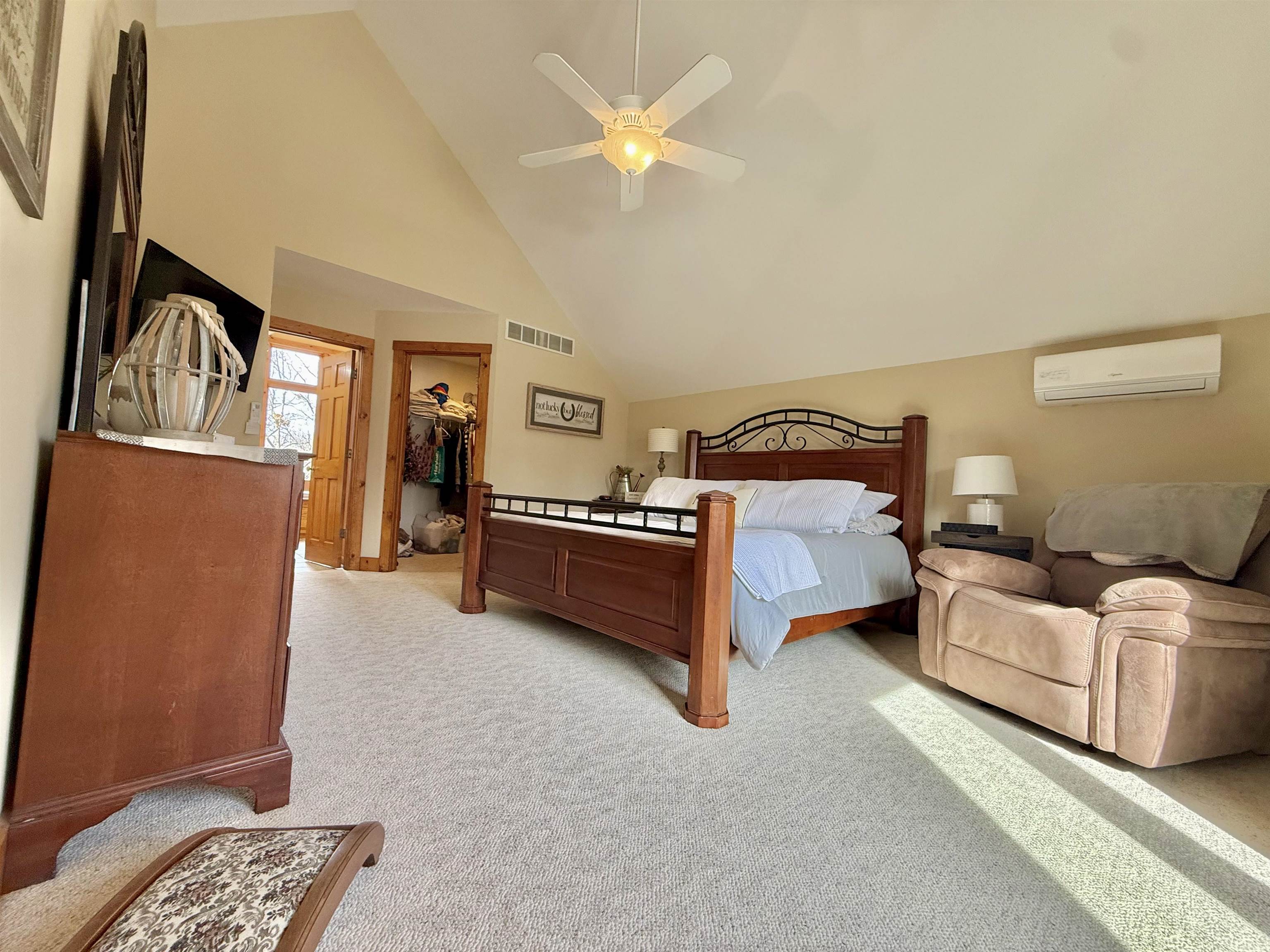 1 Tamarack Row Elizabeth, IL 61028 - Photo 16 of 38 a spacious bedroom with a bed and a chandelier
