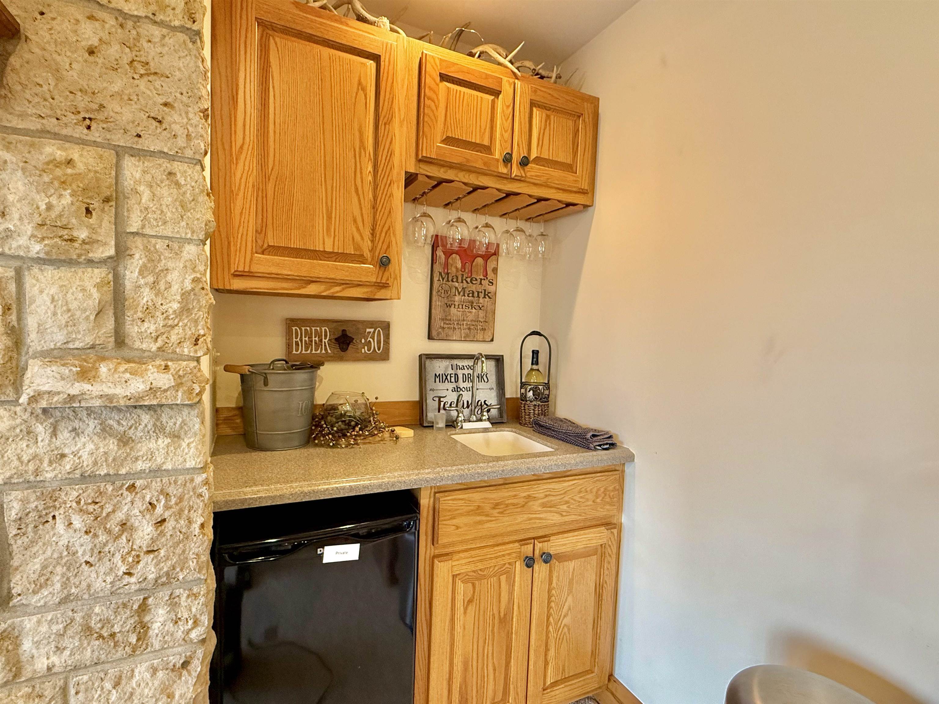 1 Tamarack Row Elizabeth, IL 61028 - Photo 24 of 38 a bathroom with a granite countertop sink and a mirror
