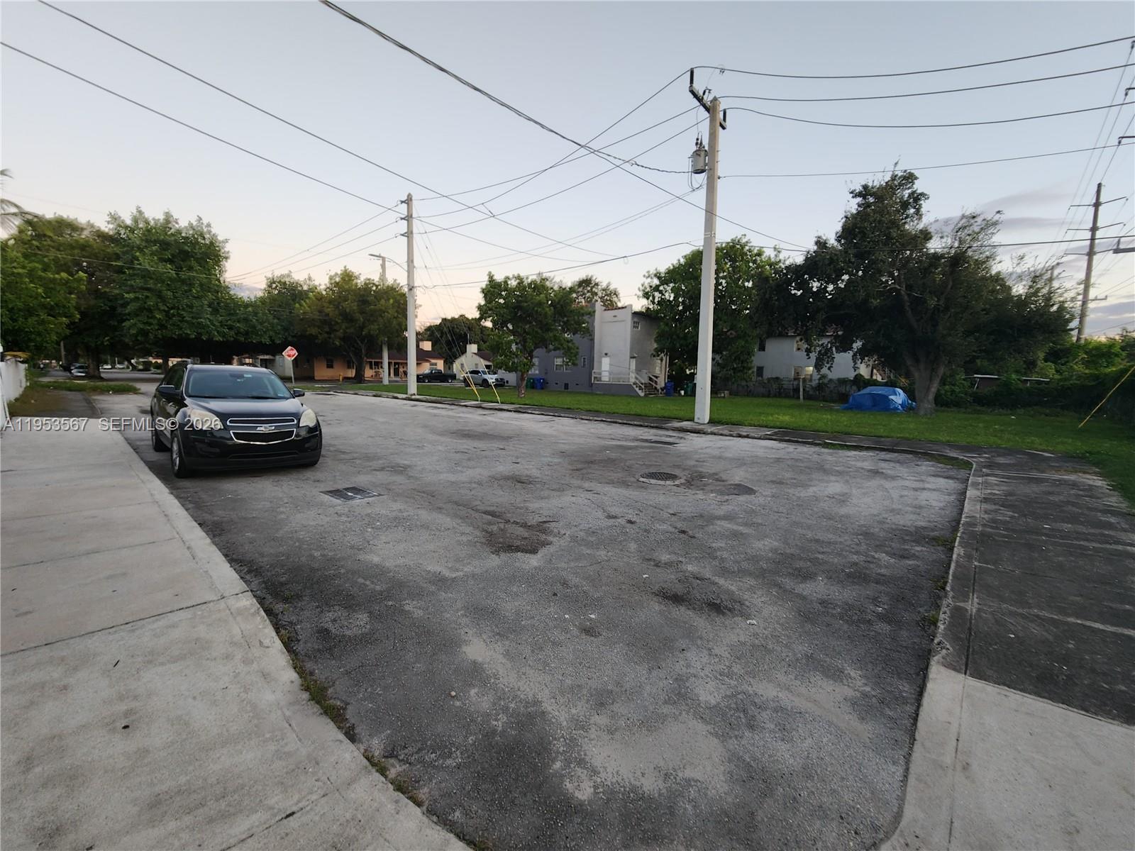405 Northwest 64th Street, Unit 2 Miami, FL 33150 - Photo 13 of 13 a view of a car in front of a house