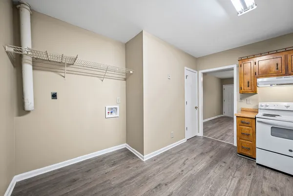 a view of a kitchen with a wooden floor