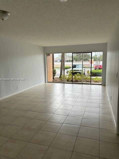 8977 Wiles Road, Unit 103 Coral Springs, FL 33067 - Photo 2 of 11 a view of an empty room and window
