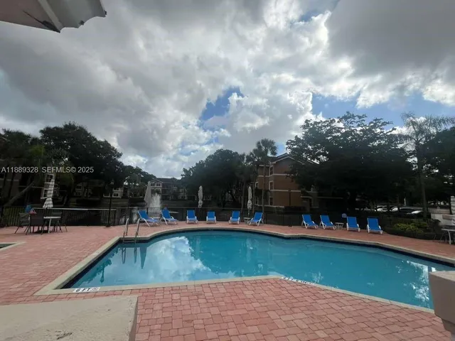 a view of outdoor space and swimming pool