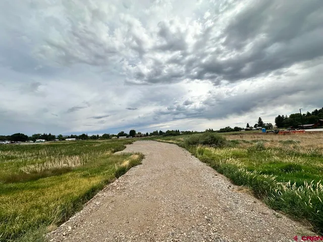 a view of a lake with houses in the back