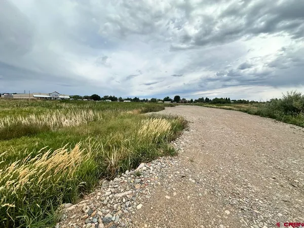 an aerial view of lake and mountain
