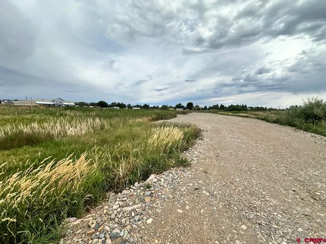 an aerial view of lake and mountain