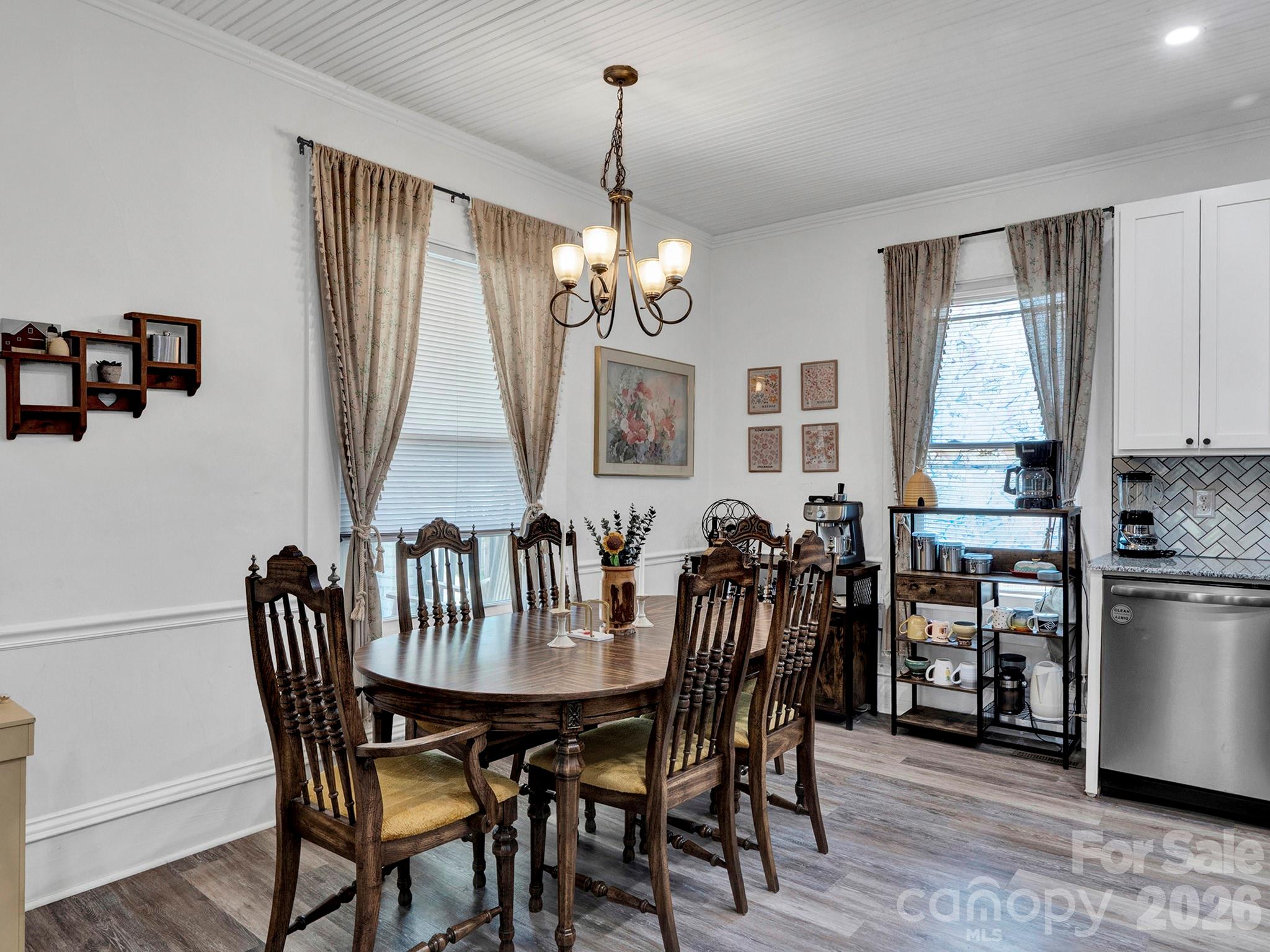 208 Hough Street Monroe, NC 28112 - Photo 14 of 32 a view of a dining room with furniture window and wooden floor