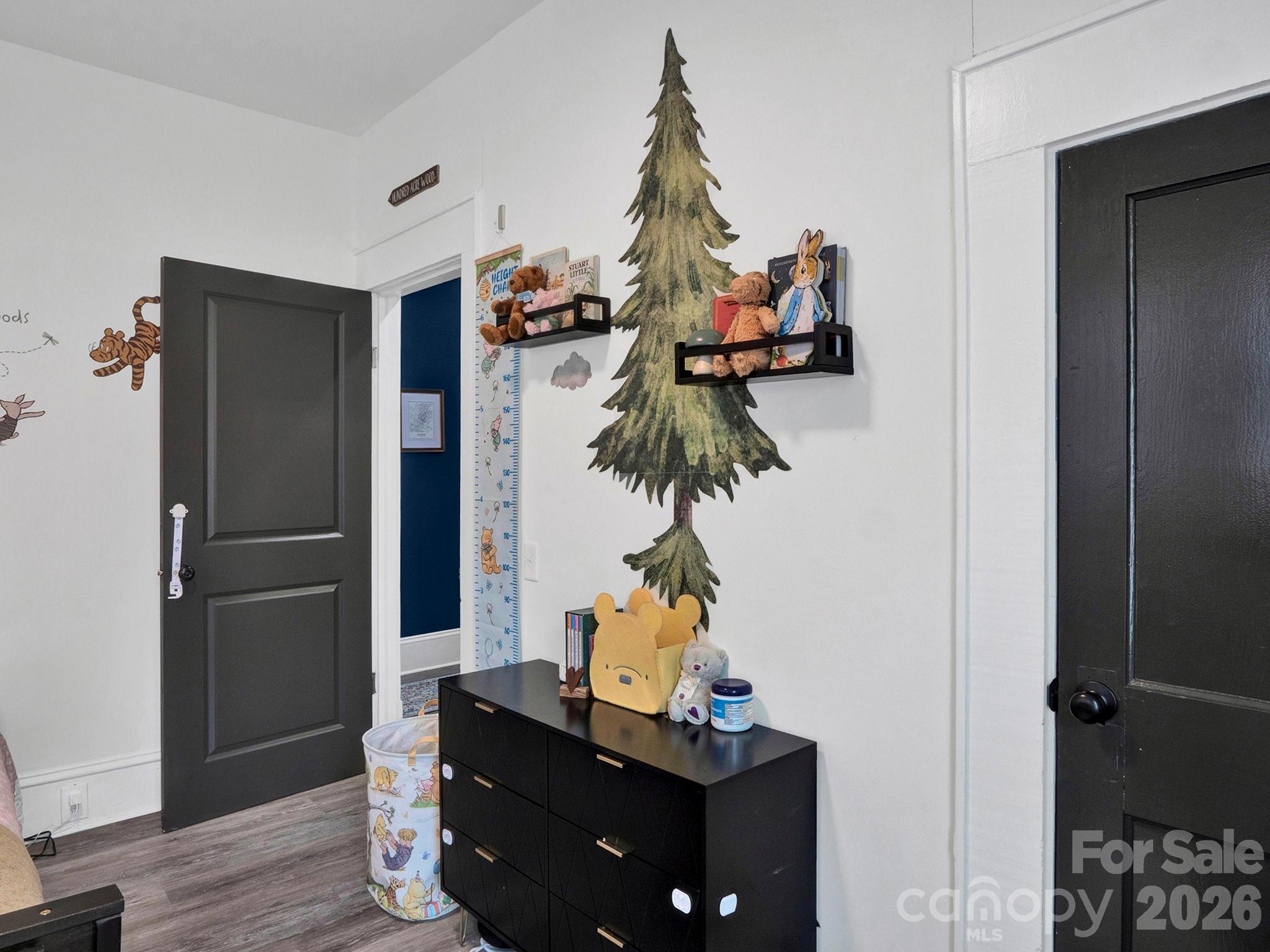208 Hough Street Monroe, NC 28112 - Photo 21 of 32 a room with furniture and a potted plant