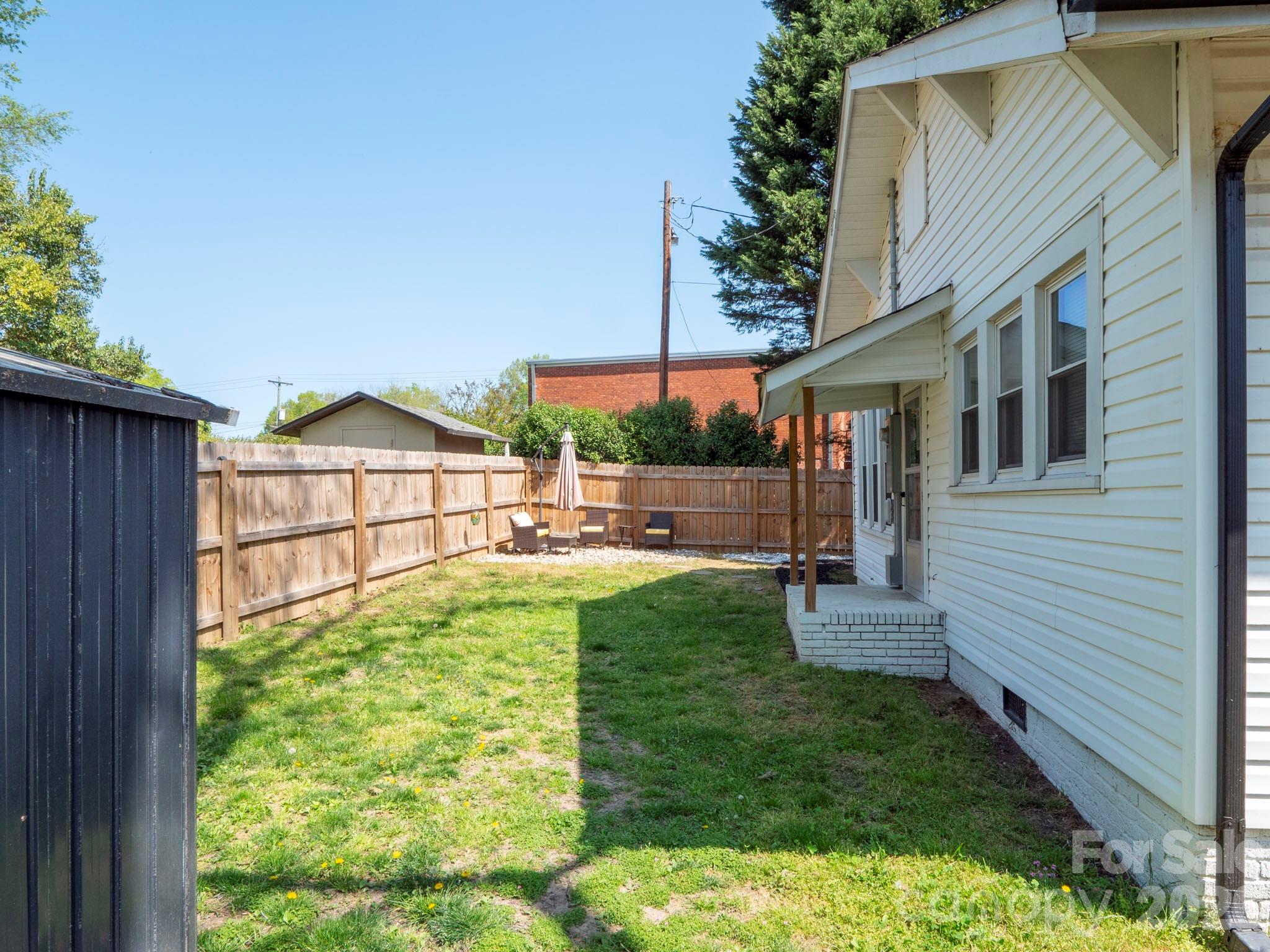 208 Hough Street Monroe, NC 28112 - Photo 29 of 32 a view of backyard with green space