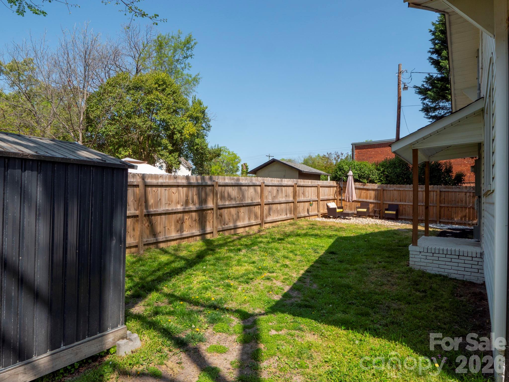 208 Hough Street Monroe, NC 28112 - Photo 31 of 32 a view of backyard with green space