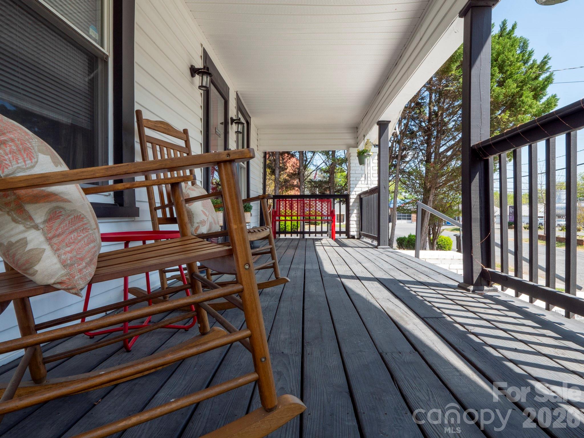 208 Hough Street Monroe, NC 28112 - Photo 4 of 32 a view of balcony with wooden floor and furniture