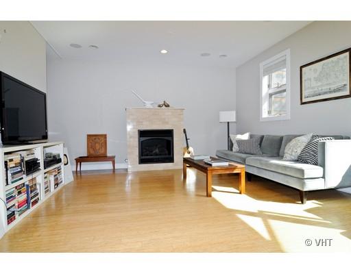 950 West Cullerton Street, Unit A Chicago, IL 60608 - Photo 3 of 12 a living room with furniture and a flat screen tv