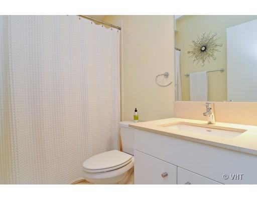 950 West Cullerton Street, Unit A Chicago, IL 60608 - Photo 10 of 12 a bathroom with a sink a toilet and shower