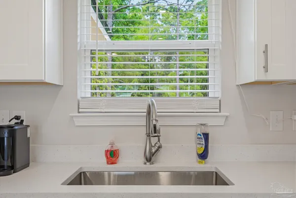a bathroom with a sink and a window