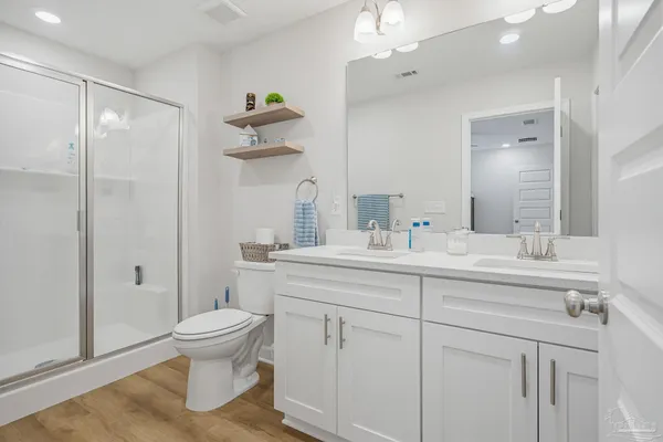 a bathroom with a sink toilet and shower