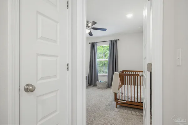 a bedroom with furniture and window