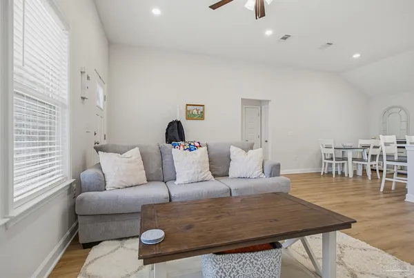 a living room with furniture and a table