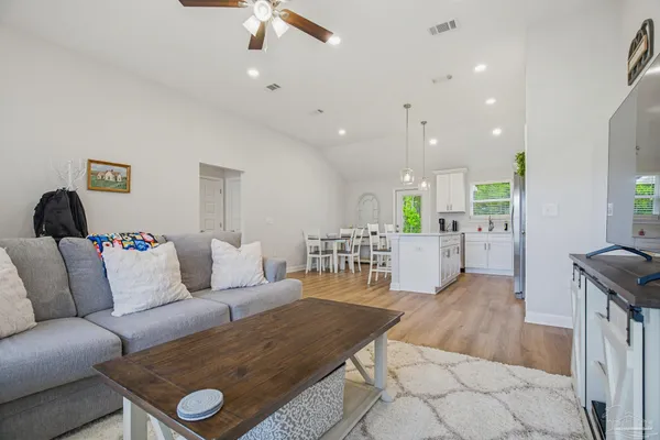 a living room with furniture and a table