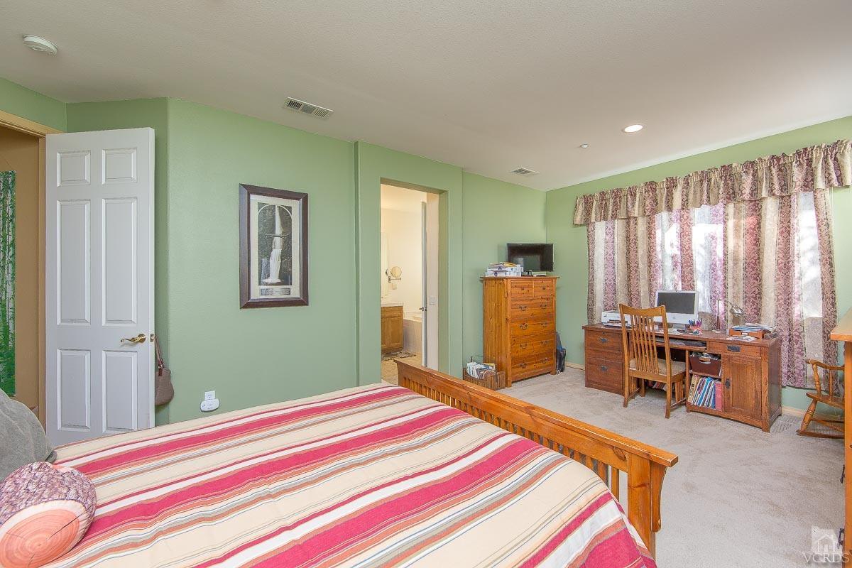 1487 Hidden Ranch Drive Simi Valley, CA 93063 - Photo 22 of 28 a bedroom with a bed and furniture