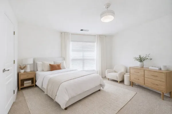 a bedroom with a bed and window