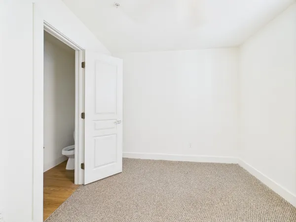 a view of a hallway with a room