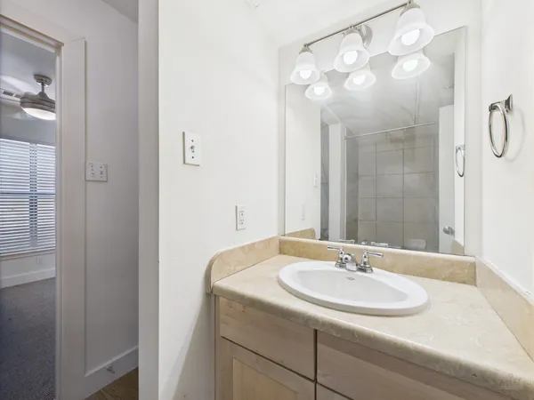 a bathroom with a sink and a mirror