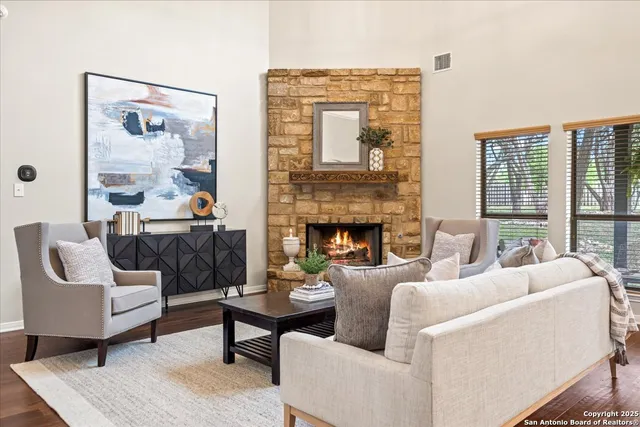 a view of a dining room with furniture wooden floor and chandelier