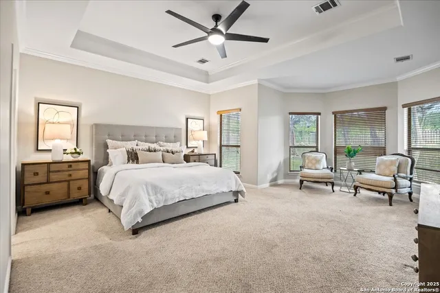 a bathroom with a granite countertop tub sink and mirror