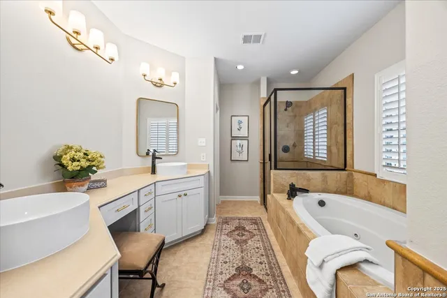 a bathroom with a tub and a shower