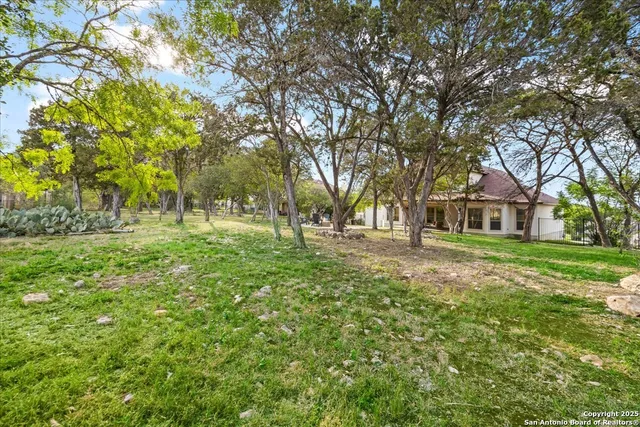 an aerial view of residential house with outdoor space
