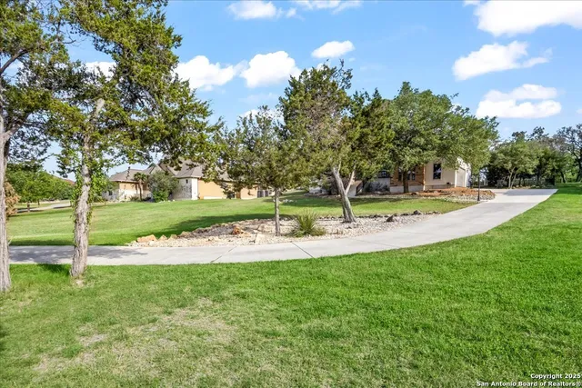 an aerial view of residential house with outdoor space and street view