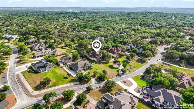 a view of a house with backyard porch and sitting area