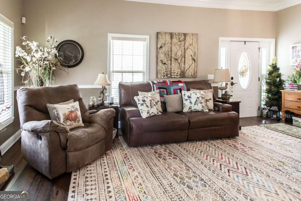 43 Graham Methodist Church Road Hazlehurst, GA 31539 - Photo 22 of 54 a living room with furniture and a large window