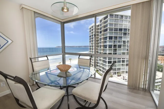 a view of a dining room with furniture and a window