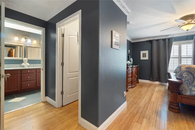 a bathroom with a granite countertop sink a mirror and shower