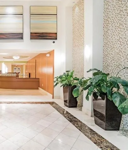 a potted plant sitting on the side of a building