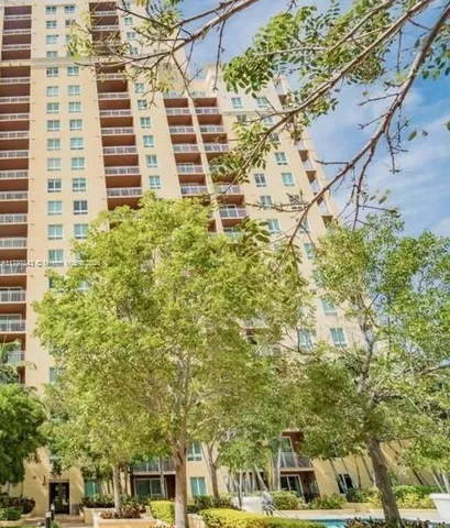a aerial view of a building and trees