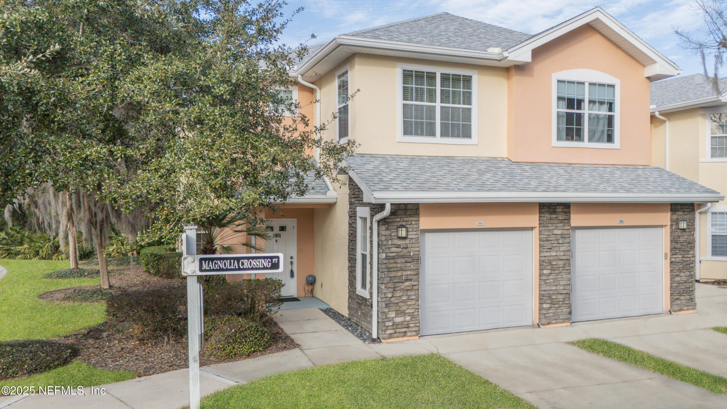 110 Magnolia Crossing Point, Unit 1901 St. Augustine, FL 32086 - Photo 1 of 26 a front view of a house with a garage
