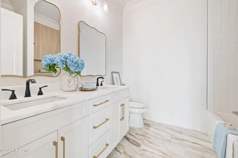 $950,000 | 305 Sunset Palm Court, Youngsville, LA 70592