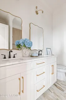 $950,000 | 305 Sunset Palm Court, Youngsville, LA 70592