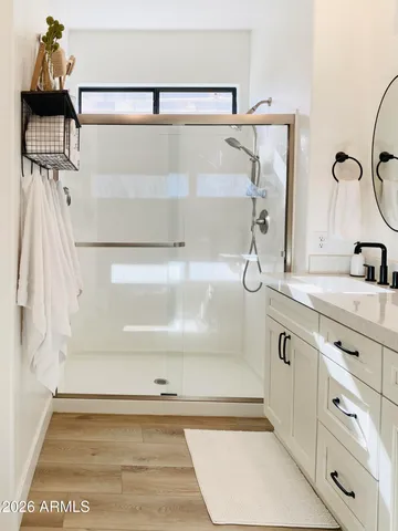 a bathroom with a sink and a shower